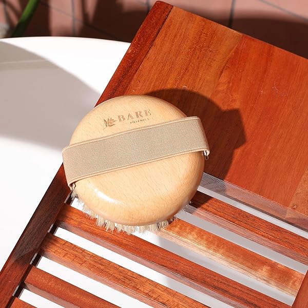 Get glowing skin with this convenient palm-sized dry brush body scrub! It's universal fit and easy to use, perfect for exfoliating in the shower. With medium firmness and an elastic strap, it's great for both women and men! #