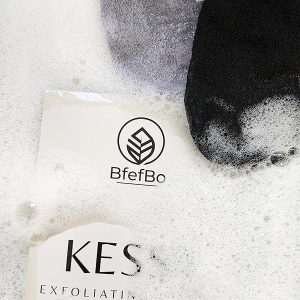 Get silky smooth skin with this ultra coarse exfoliating glove in black & grey! Made from plant-based materials, this Kessa mitt provides deep exfoliation for natural body care. #skincare #exfoliation #smoothskin