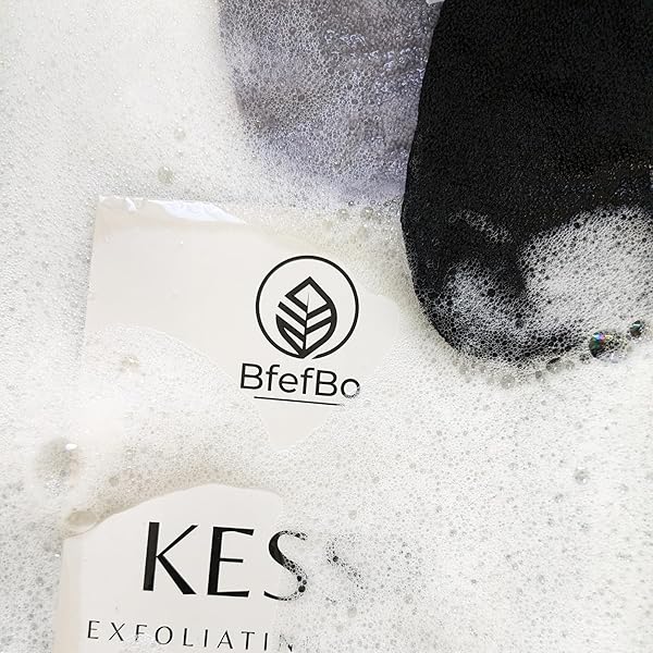 Get silky smooth skin with this ultra coarse exfoliating glove in black & grey! Made from plant-based materials, this Kessa mitt provides deep exfoliation for natural body care. #skincare #exfoliation #smoothskin