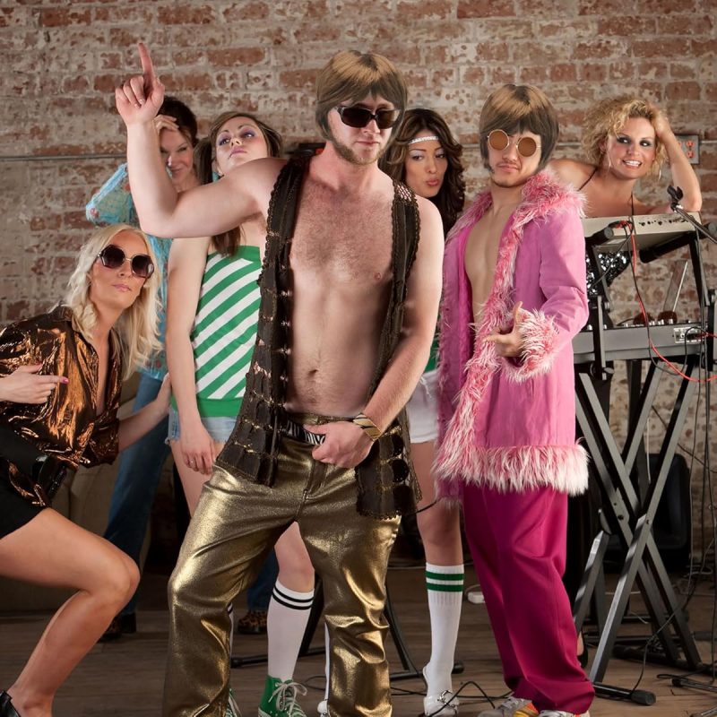 Get ready to rock your TikTok with this 70's Heartthrob Wig and Sunglasses combo! Perfect for channeling those boyband vibes or embracing your inner pop hippy. Stand out at theme parties with this 1970s inspired wig